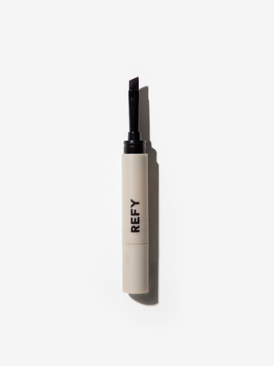 FRONT IMAGE OF REFY BROW POMADE APPLICATOR IN LIGHT